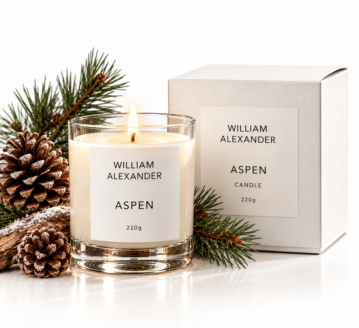 Aspen Christmas candle with gift box, pine cones and fir sprigs still life