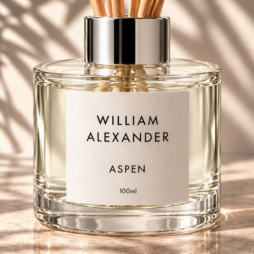 Close-up of the William Alexander Aspen Winter Pine & Sandalwood reed diffuser with natural rattan reeds and silver collar