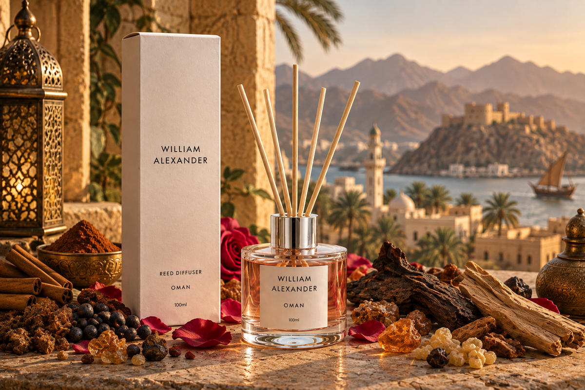 Oman Rose Oud Reed Diffuser 120ml styled with spices and dried roses overlooking an Omani harbour at sunset